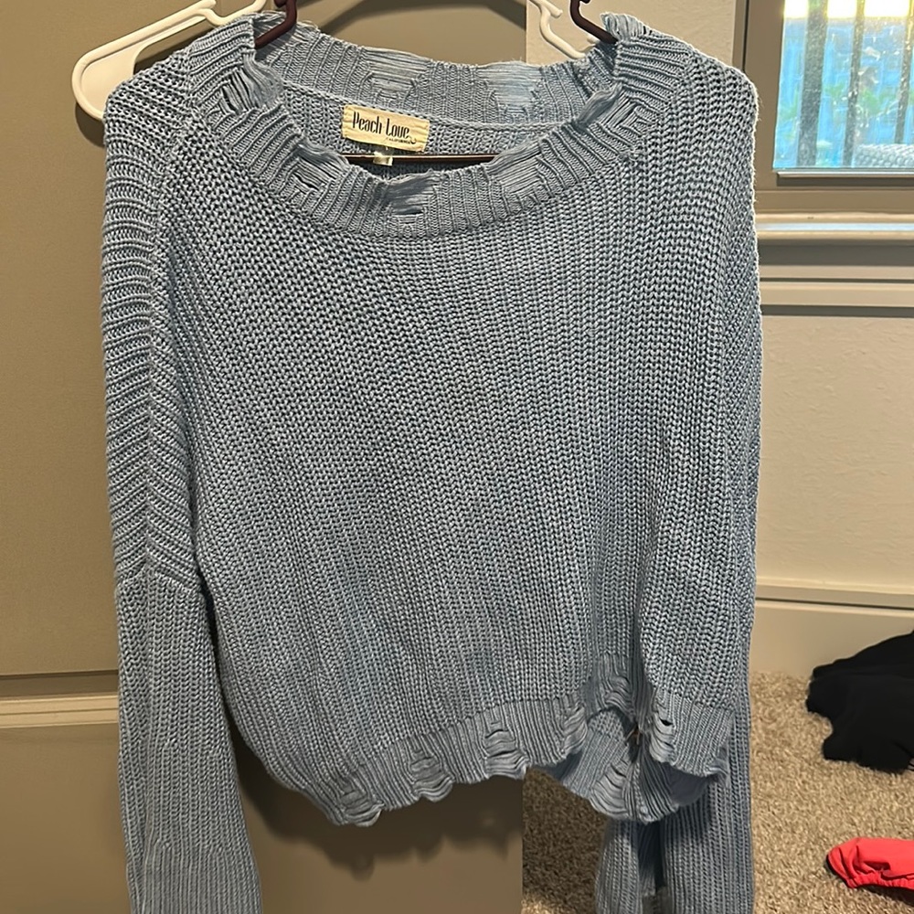 Distressed blue crop sweater